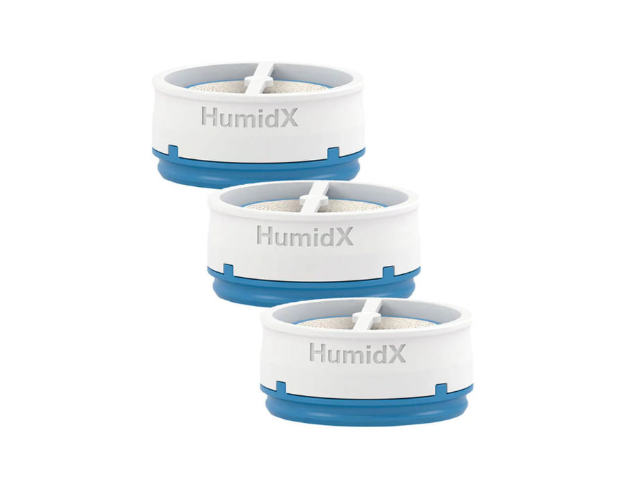 A digital image showing three ResMed HumidX waterless humidification capsules stacked diagonally, designed for use with the AirMini CPAP machine.