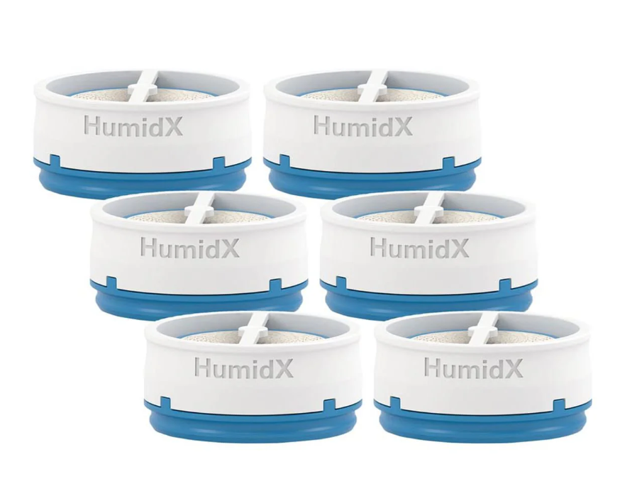 An image displaying a set of six ResMed HumidX capsules, arranged in two rows, indicating the availability of a multi-pack option.
